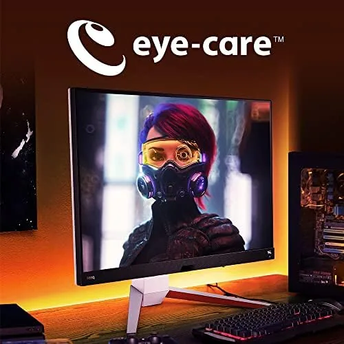 A gamer using the EX3210U with a PS5 console in the background