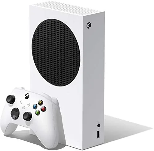 The Xbox Series S console standing upright next to a controller on a desk