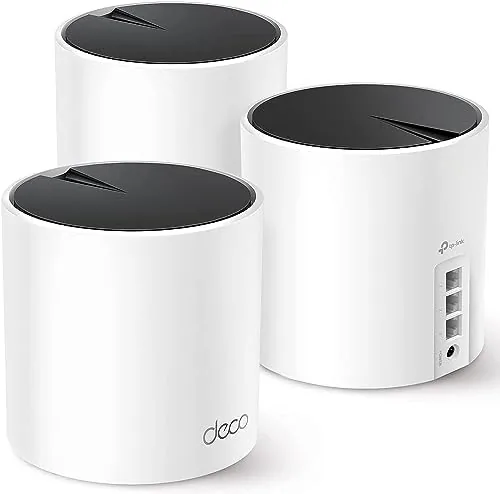 Three TP-Link Deco X55 mesh units arranged on a shelf