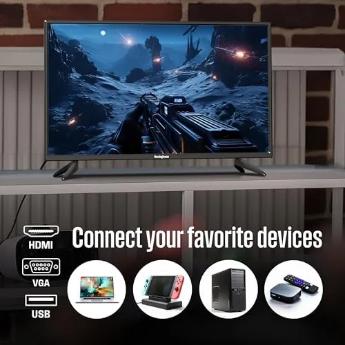 The Westinghouse TV next to a larger smart television for scale