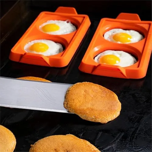 Comparison of the silicone rings with a metal egg ring on a griddle