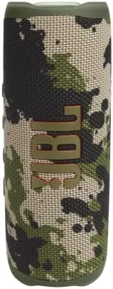The JBL Flip 6 camo speaker outdoors on a table