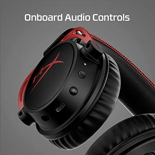 The USB dongle and detachable cable laid out beside the headset
