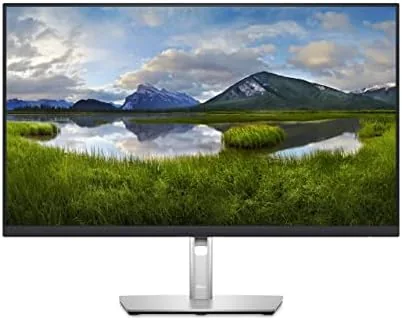 The Dell P2723QE on a desk with a laptop and a desktop connected through the monitor hub
