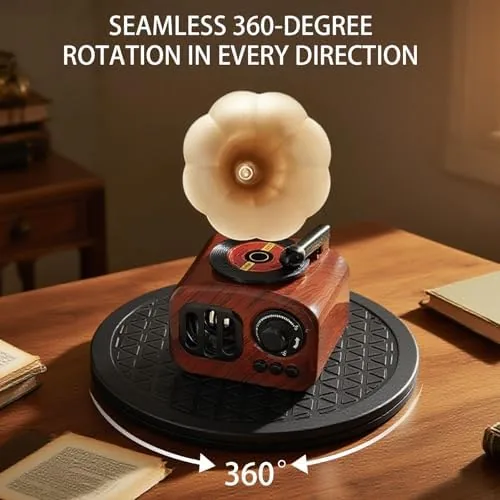 A small monitor on the rotating stand being turned to face the opposite side of a desk
