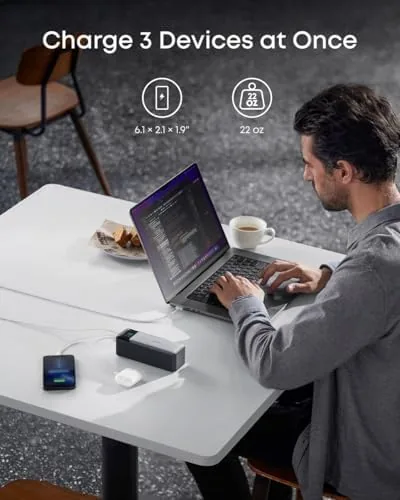 The Anker 737 power bank charging a laptop and a phone together