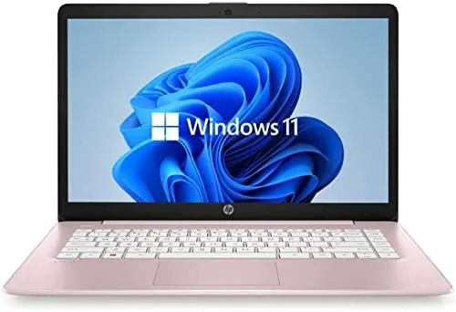 The HP 14 inch renewed laptop in Dale Pink open on a desk showing the keyboard and screen