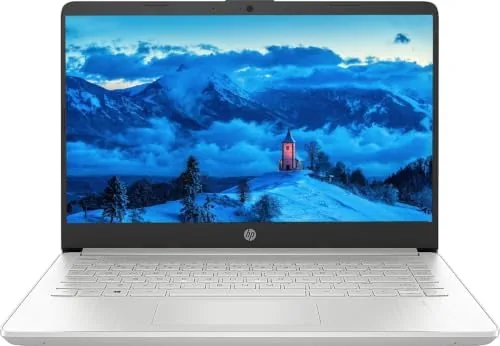 The laptop running Windows 11 with a browser and a document open side by side