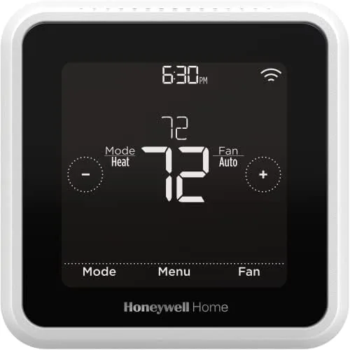 Honeywell Home T5 smart thermostat mounted on a living room wall