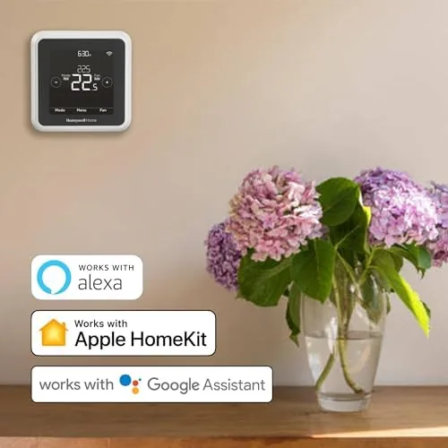 T5 thermostat next to a premium learning thermostat for comparison
