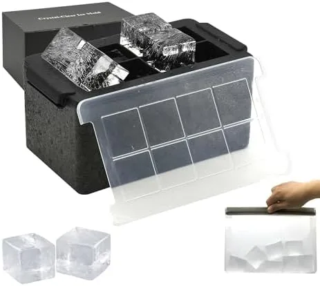 The Bangp clear ice cube maker with a fresh batch of large clear cubes on a kitchen counter