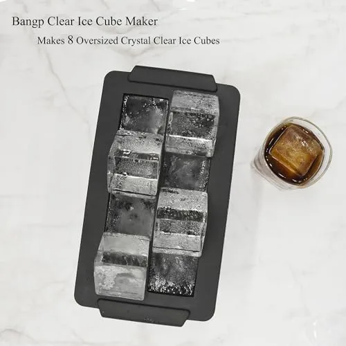 A glass of whiskey over a large clear cube from the Bangp mold