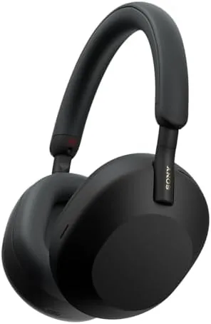 The Sony WH-1000XM5S resting on a desk in a home office