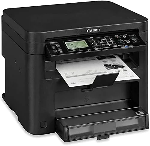 Canon imageCLASS MF242dw printer sitting on a desk with the output tray extended