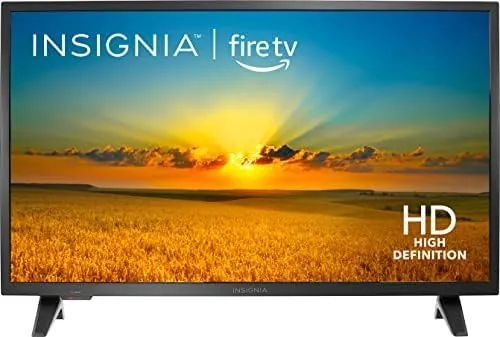 INSIGNIA 32 inch F20 Fire TV showing a streaming home screen on a media console