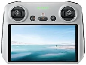 DJI RC remote controller held in two hands with the bright built-in screen showing a live drone feed