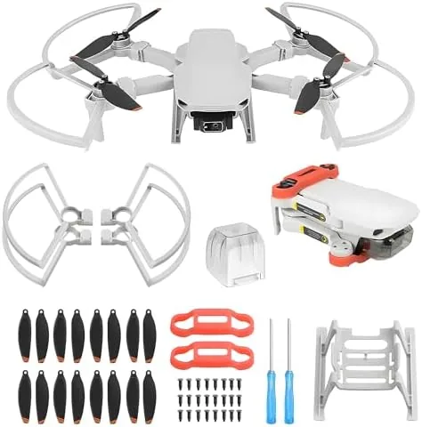 Full 24-piece drone accessory kit laid out on a table showing propellers, guard, landing gear, and gimbal cover