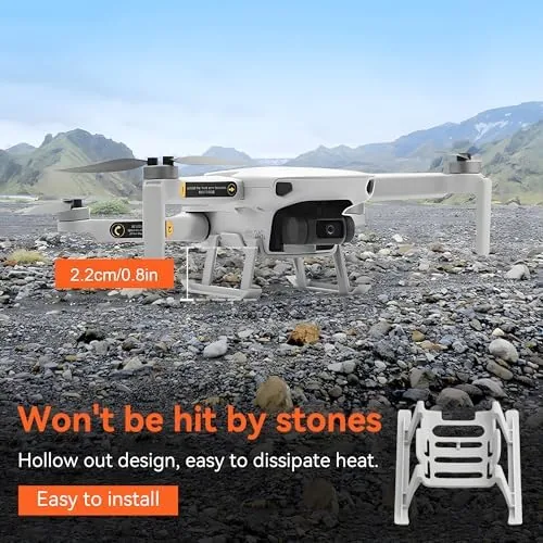 DJI Mini 2 with landing gear extensions landing on a grass field