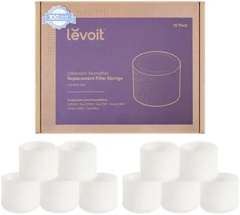 Ten Levoit humidifier filters laid out in a row on a table