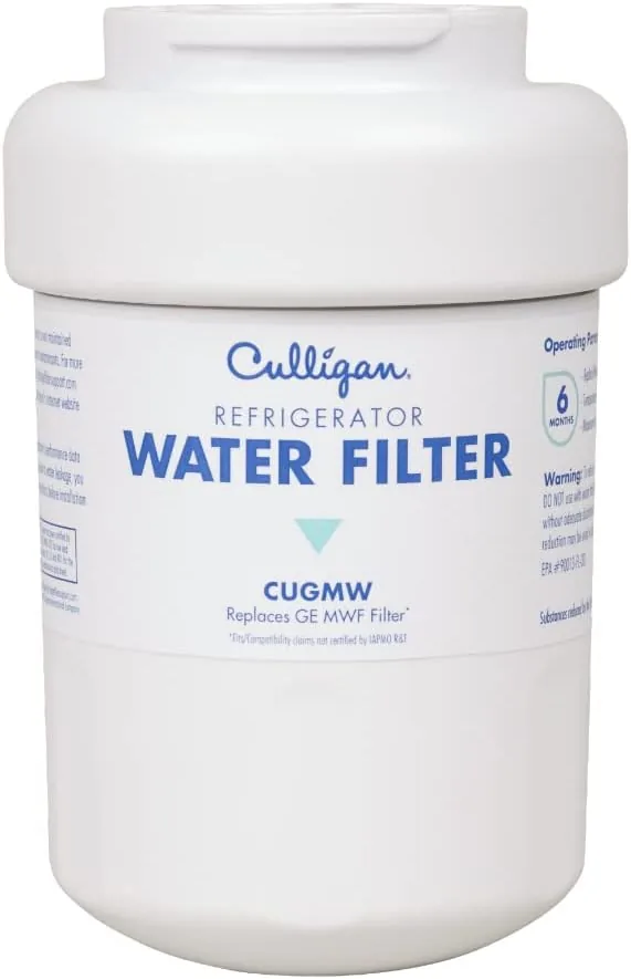 Glass of filtered water being poured from the refrigerator dispenser