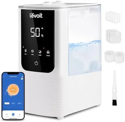 Levoit OasisMist humidifier on a nightstand in a bedroom