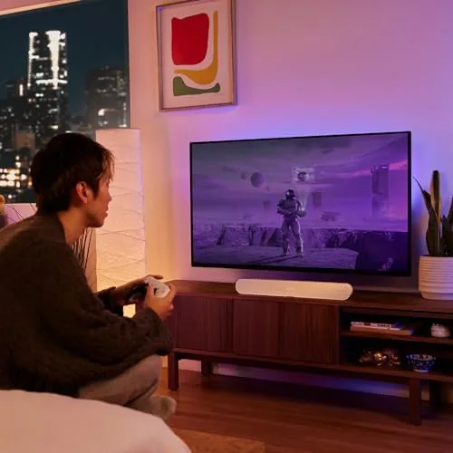 The Sonos Ray connected to a television and a phone running the Sonos app