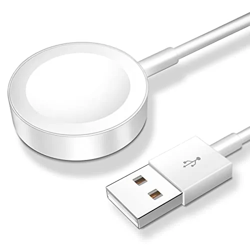 White magnetic Apple Watch charging puck with a watch resting on top