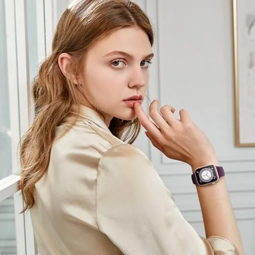 Two of the six bands on a table with the watch in the center