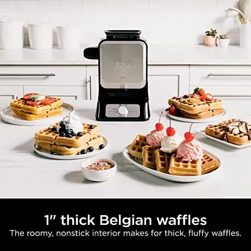 A finished Belgian waffle with tall pockets on a plate