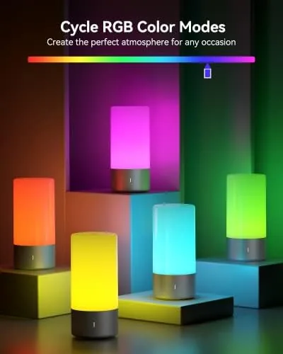 The lamp on its middle brightness setting lighting a reading chair