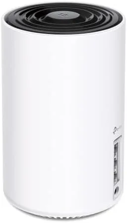 TP-Link Deco XE75 mesh node standing on a shelf in a home