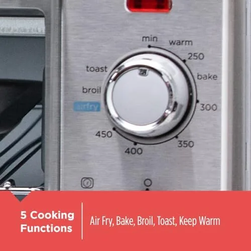 Air fried chicken wings in the basket of the BLACK+DECKER toaster oven