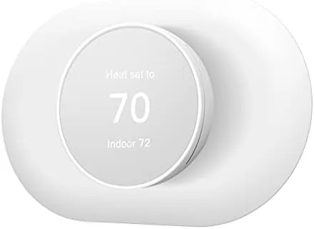 Nest Thermostat with the Snow wall plate cover installed on the wall
