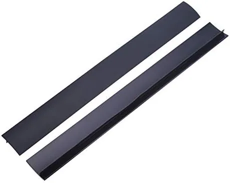 Two black silicone gap covers installed between the counter and the stove