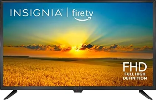 The INSIGNIA 32 inch F20 Fire TV on a stand in a bedroom
