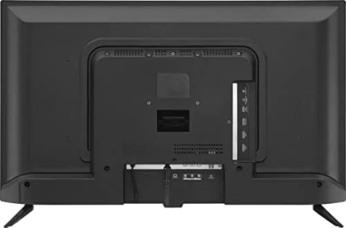 The Alexa voice remote in a hand with the TV behind it
