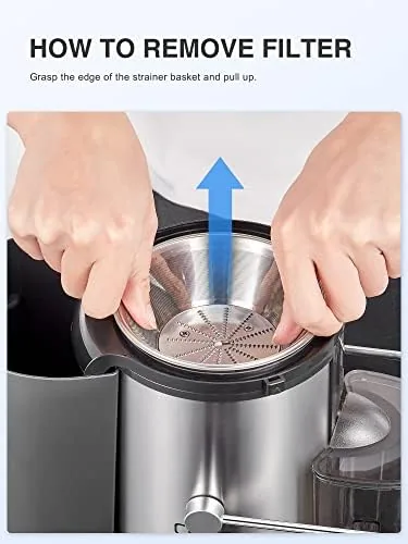 Glass of juice on a small kitchen counter beside the green juicer