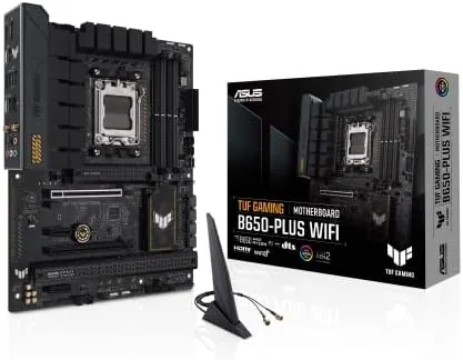 ASUS TUF Gaming B650-PLUS WiFi motherboard laid out on a desk showing the VRM heatsinks and armor
