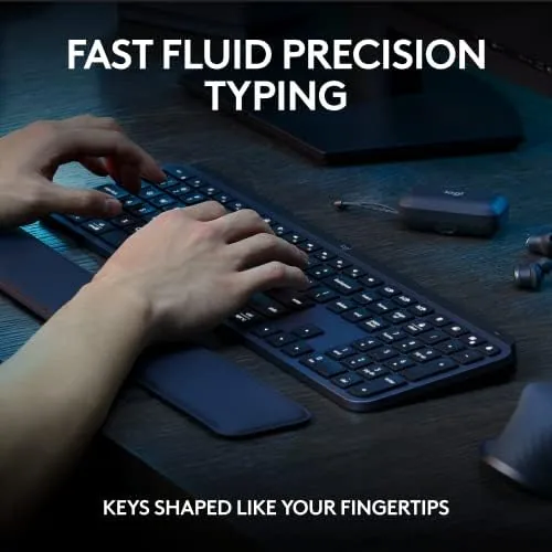 Hands typing on the MX Keys S Combo during a work session