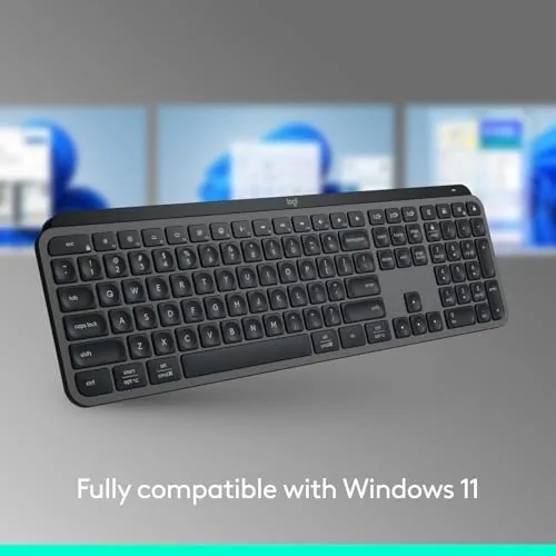 Graphite MX Keys S on a desk with a laptop and monitor
