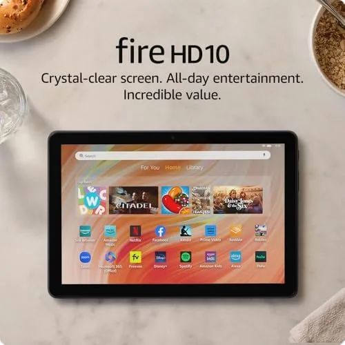 The Amazon Fire HD 10 tablet on a sofa with the Full HD display showing a movie