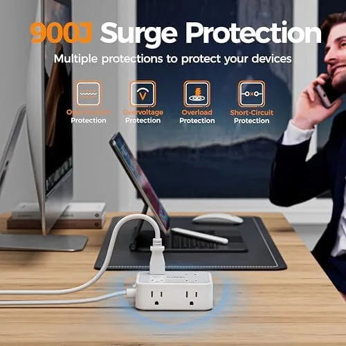 TESSAN power strip mounted on a dorm room desk beside a laptop