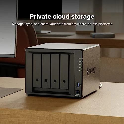 The AMD Ryzen label and open drive tray on the Synology DS923+