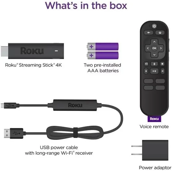 The Roku voice remote in a hand pointing at the television during a voice search