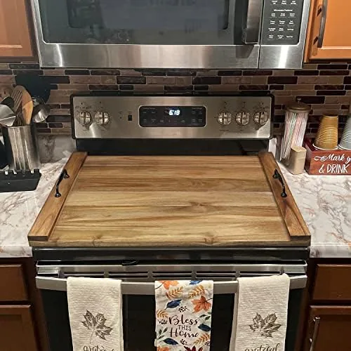 Board lifted off the stove using the side handles