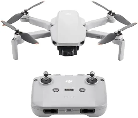 The folded DJI Mini 2 SE held in an open palm showing its small size