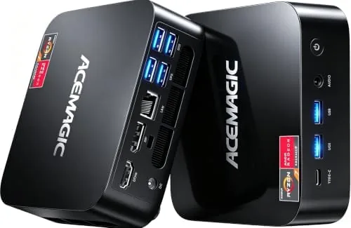 ACEMAGIC K1 mini PC on a desk next to a small monitor and keyboard