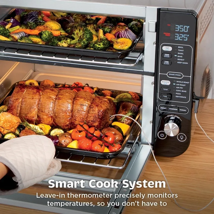A roast chicken in the bottom zone with the Smart Cook thermometer probe inserted