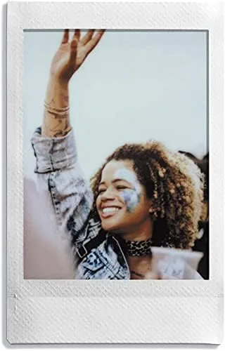 An Instax Mini film cartridge loaded into a Mini 11 camera
