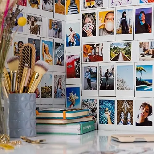 An Instax Mini print being handed over at a party table